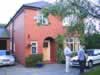 Tim & Sally (with Lee) in front of their home (41,272 bytes)